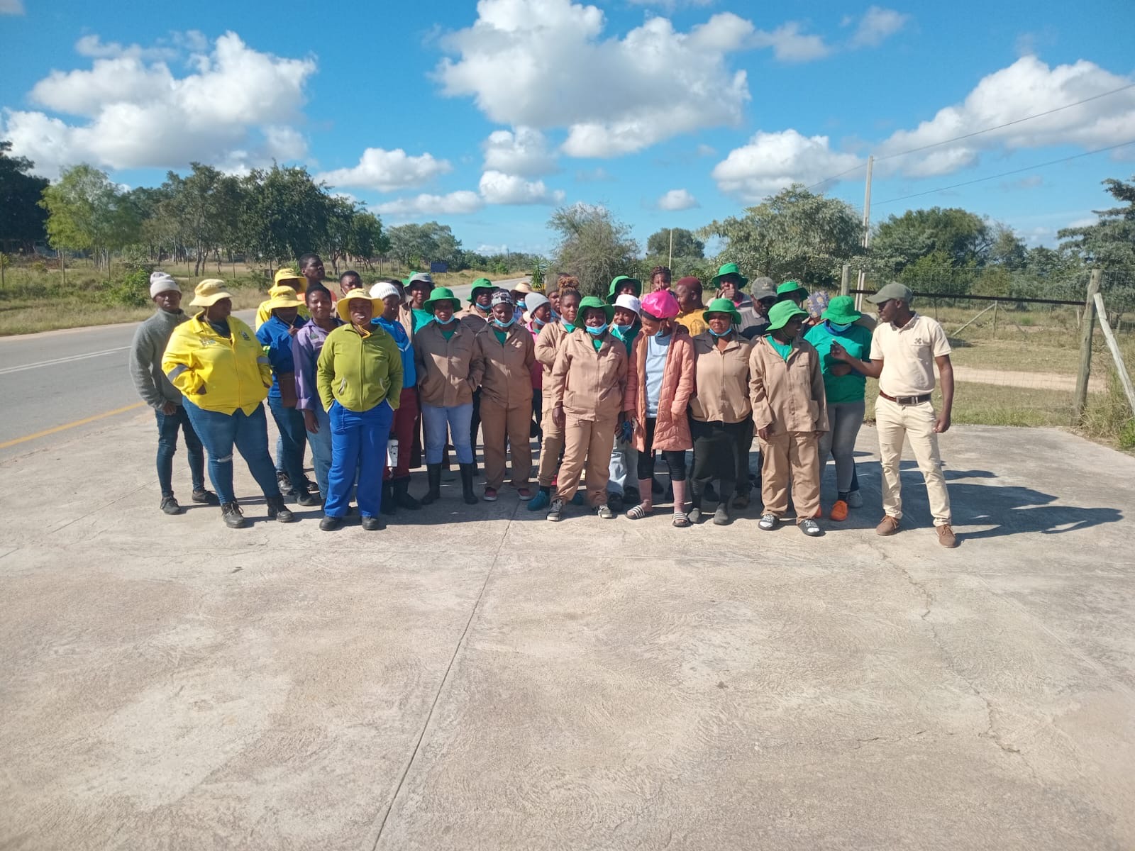 The volunteer team gathered on the road.