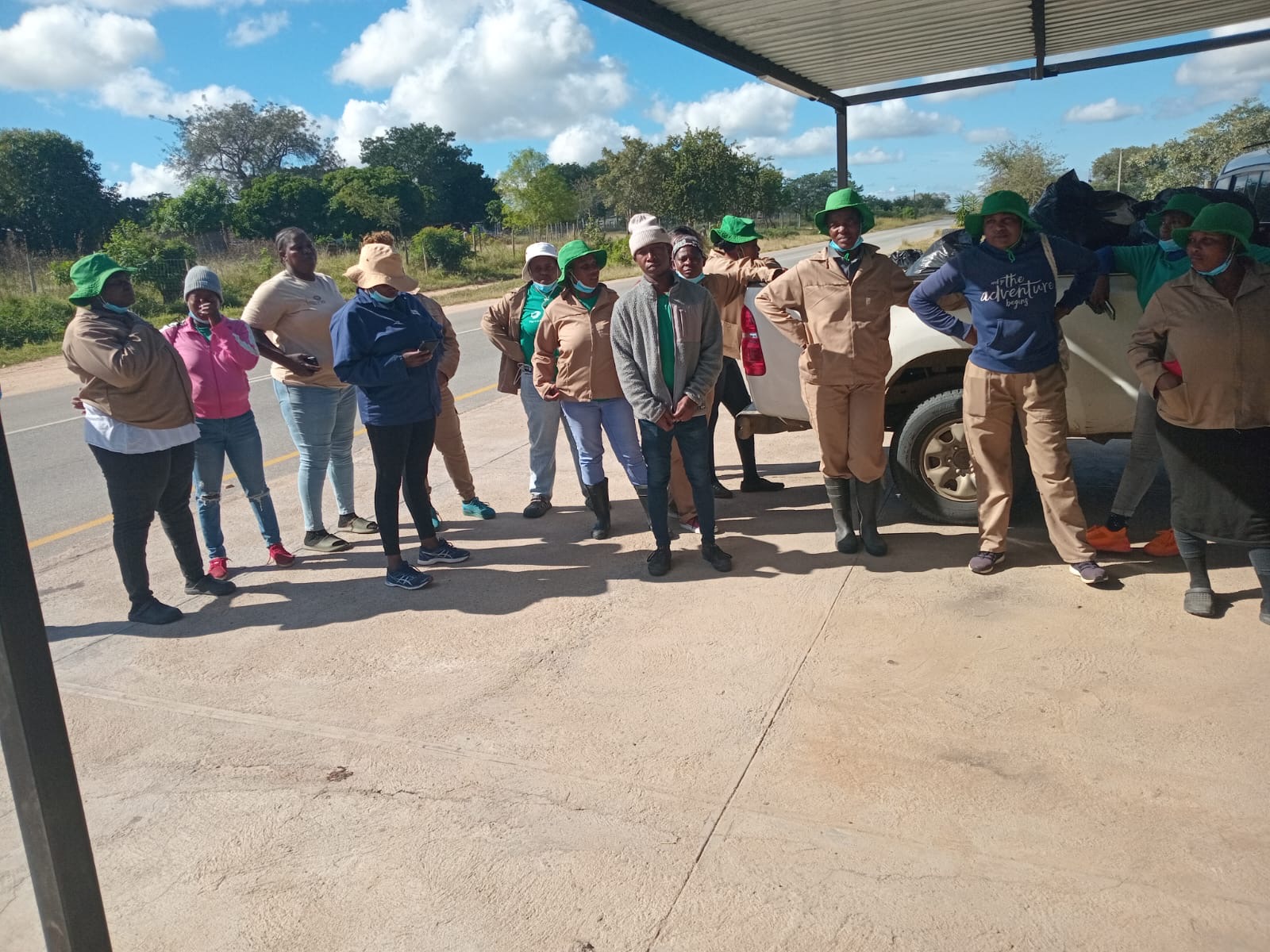 The team gathered under the shelter between stretches of work.